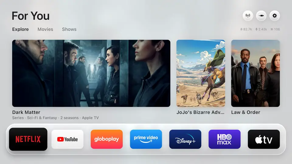 https://github.com/simbasjungles/free-my-tv/blob/HEAD/The Free My TV home screen: a glass shelf of apps, trending picks, and a drawer with the weather and crypto prices